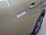 a sticker on the side of a car door