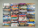 a lot of dvd ' s stacked on top of each other