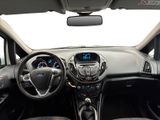 the interior of a car with a steering wheel, dashboard, and dashboard lights