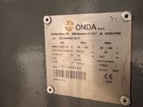 a metal sign on the side of a machine