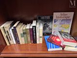 many books that are on the shelf in the room