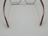 a close up of a pair of glasses on a white surface
