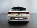 the rear end of a white suv parked in a room