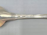 a spoon with a spoon handle on it on a table