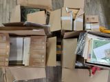 a pile of boxes that are sitting on the floor