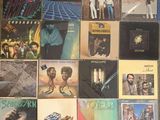a lot of records on the floor of this room
