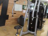 a gym room with a variety of machines in it