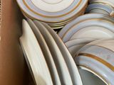 a box full of plates and bowls in it