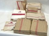 a lot of towels and napkins sitting on a table