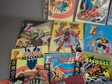 a lot of comic books sitting on a table