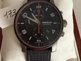 a black and red watch in a box on a table