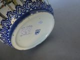 a blue and white vase sitting on a table