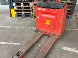 a fork lifter that is sitting in a warehouse