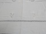 a white table cloth with a design on it