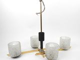 an image of a chandelier with four glasses and a candle holder