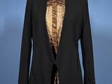a black blazer with a leopard print shirt on a mannequin mannequin mannequin mannequin mannequin mannequin mannequin