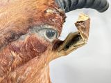a close up of a fake animal with a very long horn