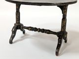 a small table with a marble top on a white background