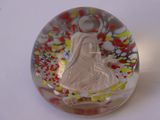a glass object with a picture of a woman inside of it