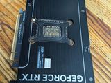 a close up of a video card sitting on top of a wooden floor