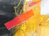 a picture of a yellow fire hydrant with graffiti on it
