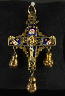 an image of a cross with bells hanging from it ' s side
