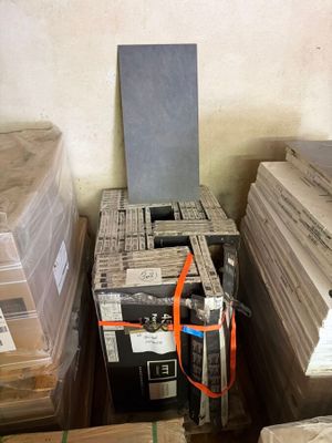 a stack of boxes and a box with a remote in it