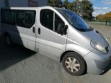 a silver van that is parked in a parking lot