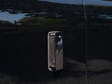 an image of a black car parked on the side of the road