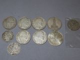 some coins are sitting on a table next to a plastic bag