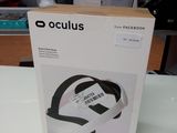 the box is open on the table with the headphones in it
