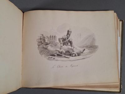 un vieux livre sur lequel figure le dessin d'un homme allongé par terre