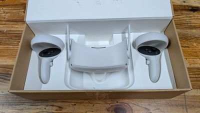 a white box with a pair of airpods inside of it