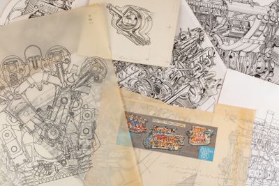 a lot of drawings on top of a pile of papers
