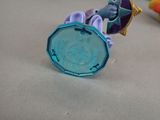 a toy elephant that is sitting on top of a coin