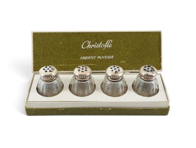 three salt and pepper shakers in a box on a white surface