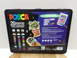 the back of a plastic box with a plant in it on a wooden table