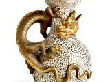 a vase with a dragon on it on a white background