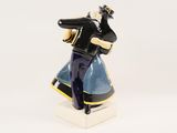 a figurine of a man with a baseball bat in his hand