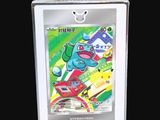 a close up of a pokemon trading card in a box