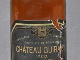 bottle of chateau au gurn whisky sitting on a table