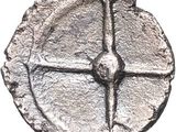 an old silver coin with a cross on it