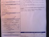 an image of a paper with a picture of a car ' s driver ' s license