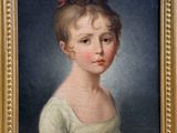 portrait of a young girl in a white dress with a red bow