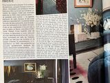 article in a magazine about a living room with a couch and a coffee table
