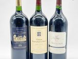 trois bouteilles de vin posées l'une à côté de l'autre sur une table
