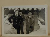 two men in military uniforms standing next to each other