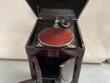 a small wooden cabinet with a record player inside of it