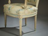 an image of a chair with a floral upholstered back and arms