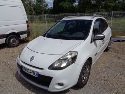 a picture of a small white car parked in a lot